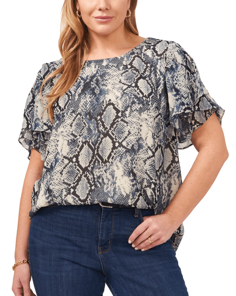 Front of a model wearing a size 1X Madelyn Snake Print Blouse in Vintage Blue by Vince Camuto. | dia_product_style_image_id:261765